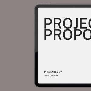May include: A digital tablet displays a presentation slide with the words "PROJECT PROPOSAL" in bold black text. Below, it reads "PRESENTED BY THE COMPANY." The background is a light gray, with the words "MODERN TEMPLATE" in the upper left corner.