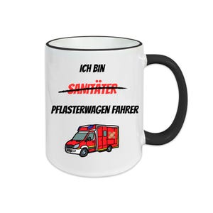 May include: White ceramic mug with a black handle and rim. The mug features the text "ICH BIN PFLASTERWAGEN FAHRER" in black and red, with a crossed-out word above. A red ambulance illustration is also on the mug.
