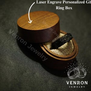 May include: A black ring with an intricate design sits inside a wooden ring box. The box is engraved with the words "Laser Engrave Personalized Gift Ring Box" and "Venron Jewelry".