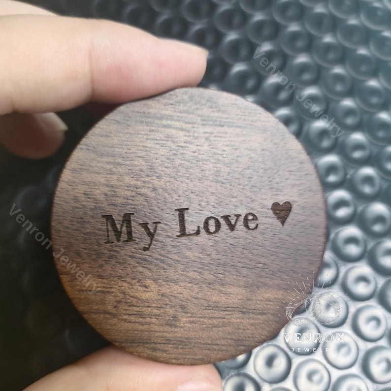 May include: A round wooden box with the words "My Love" engraved on the top, along with a small heart symbol.