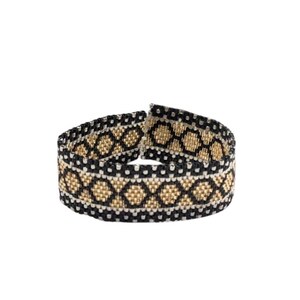 May include: A woven beaded bracelet featuring a repeating geometric diamond pattern in black, metallic gold, and white. The band is constructed from small, uniform beads arranged in horizontal rows, creating a textured, flexible, and circular structure.