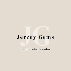 May include: A logo design on a light beige background featuring the large, pale, semi-transparent letters JG in the center. Overlaid in black text is the name Jerzey Gems, with the words Handmade Jeweler positioned directly underneath in black.