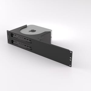 May include: A black rack mount for a computer, with a silver computer visible. The rack has two rows of ports and a sliding front panel. The computer has the Apple logo on top.