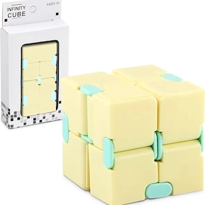 May include: A yellow and light blue Infinity Cube toy. The cube is made of eight connected blocks that can be folded and manipulated. The packaging reads "INFINITY CUBE" and "AGES 3+".
