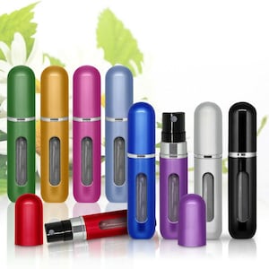 May include: A set of ten refillable travel perfume atomisers in various colours, including green, gold, pink, blue, and silver. The atomisers are made of metal and have a clear glass window to see the level of perfume.