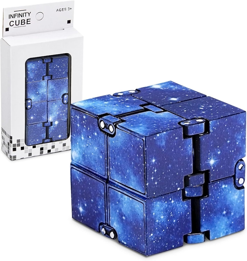 May include: An Infinity Cube toy with a blue galaxy design. The cube is shown folded and unfolded, with the packaging visible. The packaging reads "INFINITY CUBE" and "AGES 3+".