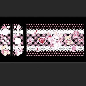 May include: A vinyl skin decal set for a gaming console and controllers featuring a black and pink gingham pattern, white lace borders, and illustrations of white rabbits, teddy bears, pink bows, hearts, and vintage telephones.