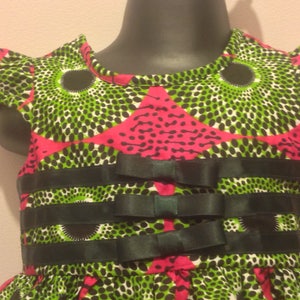 Special occasion dress party dress celebration African print green and pink girl's dress with ribbon detail in African Ankara print
