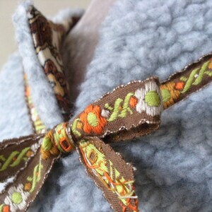 Fun fur teddy bear body warmer with ribbon ties, size 6 to 12 months