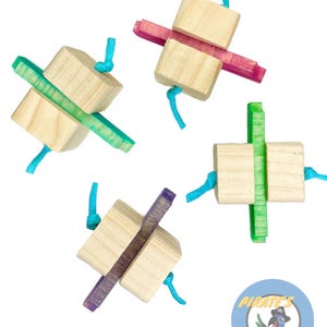 May include: Four wooden bird toys with colorful wooden pieces and blue string. The toys are designed to be hung from a cage.