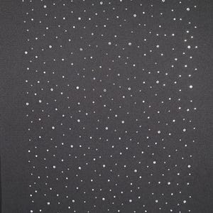 May include: A dark gray fabric is densely covered with small, sparkling, round, silver-colored embellishments. The embellishments are scattered across the surface, creating a textured, glittering effect. The overall appearance is elegant and sophisticated.