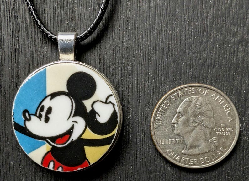 May include: A set of three ceramic mugs with a speckled, matte finish. The mugs are in shades of cream, light gray, and dark gray. Each mug has a simple, minimalist design, perfect for coffee or tea.