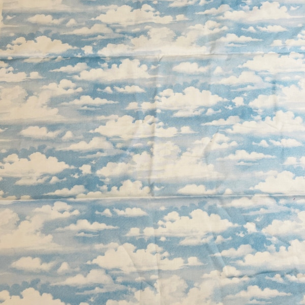 Bringing in The Harvest by John Sloane Quilting, Sewing Fabric. White Fluffy Clouds on Blue Directional 100% Cotton Fabric. 1/2 Yard.