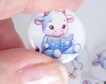 HANDMADE Buttons.  6 Cute Cow in Blue Pajamas Reading.    Washer and Dryer Safe.  Assorted Sizes available.