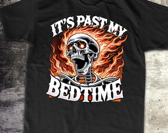 May include: Black t-shirt with a graphic of a skull on fire and the text "It's past my bedtime".