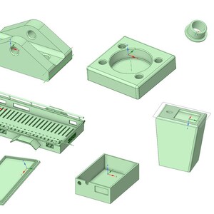 以下が含まれることがあります： 薄い緑色の3Dプリントパーツのセット。パーツには、トレーラーベッド、ボックス、ブラケット、スタンド、フック、キャップ、小さなロッドが含まれています。