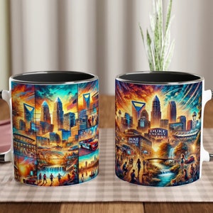 Può includere: Due tazze in ceramica bianca con bordi e manici neri. Entrambe le tazze presentano un design di città colorato con uno skyline, edifici e un fiume. Il testo "DUKE ENERGY GAME" è visibile su una delle tazze.
