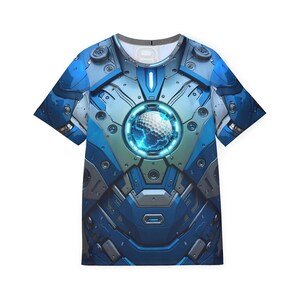 May include: A short-sleeved t-shirt featuring a futuristic design in shades of blue, gray, and silver. The graphic resembles a high-tech suit of armor with a glowing circular element at the center. The design incorporates mechanical details and a golf ball.