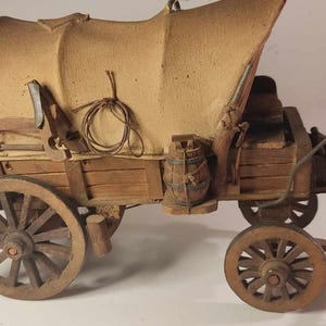 Vintage wooden, tarpaulin-covered "Wild west" carriage model