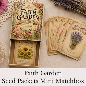 May include: A rectangular matchbox labeled Faith Garden Seed Packets containing individual seed packets. The box features floral illustrations and text. Beside it, a fan of seed packets includes one labeled Lavender Prayer Garden Seeds and another Sunflower Praise Seeds, each with printed scripture verses.