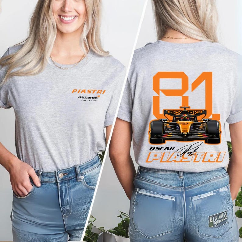 May include: A light gray t-shirt featuring the name "PIASTRI" and "McLaren" in orange. The back of the shirt displays the number "81" in orange, a race car graphic, and the name "OSCAR PIASTRI".