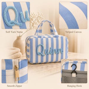 May include: A rectangular toiletry bag made of blue and white striped canvas fabric. The name Quinn is applied to the front in blue yarn lettering. The bag features two top handles, a gold-toned metal zipper, and an internal black hanging hook.