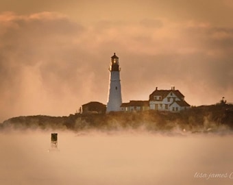 Spectacular Sea Smoke surrounding Portland Head Light in Cape Elizabeth.  Maine Landscape Photographer