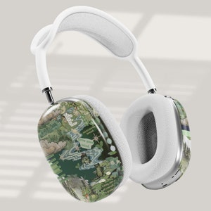 May include: White wireless headphones with a green and white patterned design. The design features a collage of images and text, including the words "grow your mind" and "I take care of myself in product".