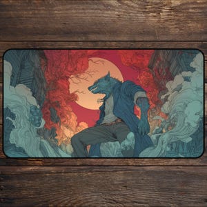 May include: A rectangular mouse mat with a stylized illustration of a werewolf in a city setting. The werewolf is depicted in blue tones, with a red and orange background, and a full moon. The design has a comic book or graphic novel style.