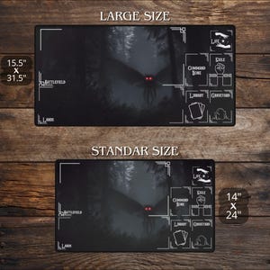 May include: Two black playmats with a forest scene and a moth-like creature with red eyes. The large mat is 15.5" x 31.5", and the standard mat is 14" x 24". Each mat has game zone labels.