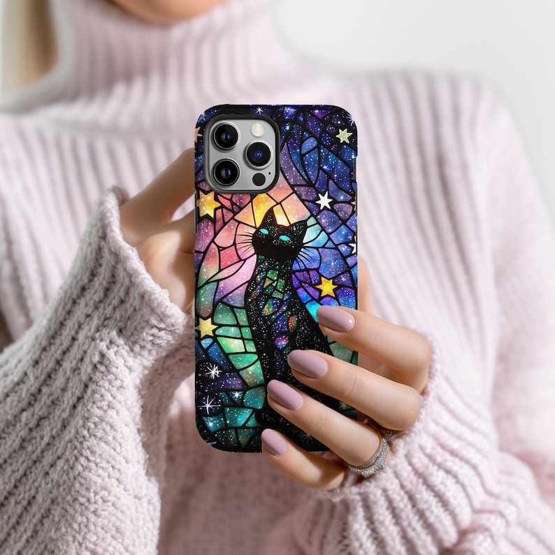 May include: A black cat with a galaxy pattern in a stained glass style on a phone case. The case is black and has a rainbow color scheme.