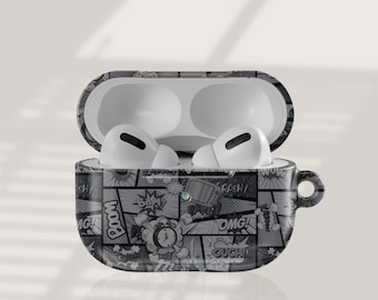 May include: White wireless earbuds in a black and white comic book-style case. The case is open, showing the earbuds and the interior. The case features a handle on the side, and comic book text.