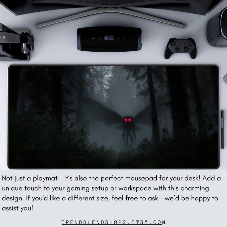 May include: Black rectangular mousepad featuring a dark forest scene with a winged creature with glowing red eyes. The text on the mousepad reads "TRENDBLENDSHOPS.ETSY.COM".