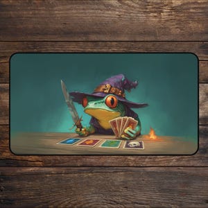 May include: A whimsical illustration of a frog wizard wearing a purple hat and robe, holding a sword and cards. The frog has large orange eyes and is sitting at a wooden table with cards laid out. A small flame is visible.
