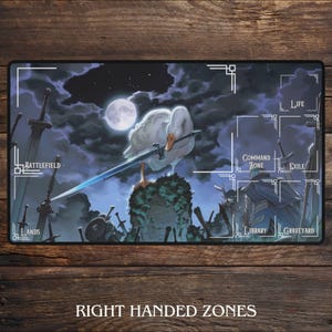 May include: A rectangular playmat featuring a white goose holding a sword, set against a night sky with a full moon. The mat has labeled zones for gameplay, with the text "RIGHT HANDED ZONES" at the bottom.