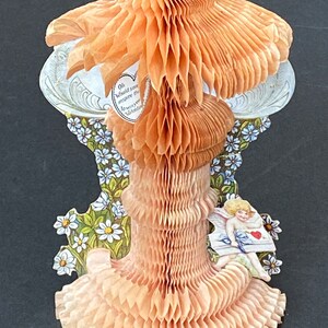 May include: A vintage Valentine's Day card with a pop-up design. The card features a heart-shaped design with the text "Oh would you inspire me to win you Valentine". The card is made of paper and has a delicate, intricate design.