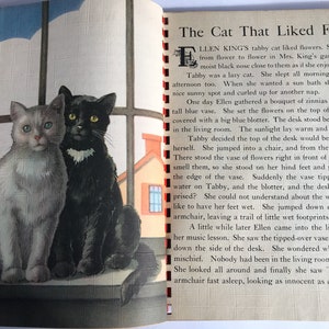 May include: A black and white cat and a gray and white cat are sitting on a windowsill. The black cat has a white patch on its chest. The gray cat has green eyes. The cats are looking at the camera. The image is from a children's book about a cat who likes flowers.