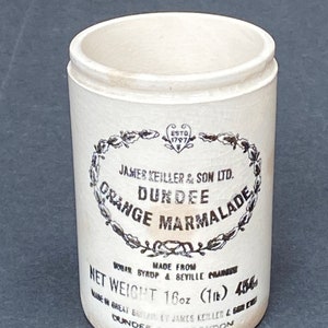 May include: White ceramic jar with a black label that reads "James Keiller & Son Ltd. Dundee Orange Marmalade" and "Net Weight 16oz (1lb) 456g".