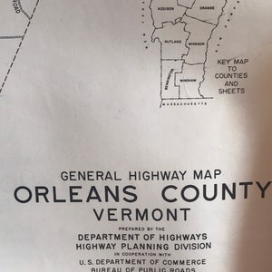 May include: A black and white map of Orleans County, Vermont, showing the county's location within the state and its bordering counties. The map is titled "General Highway Map Orleans County Vermont" and includes the text "Prepared by the Department of Highways Highway Planning Division in cooperation with U.S. Department of Commerce Bureau of Public Roads". The map also includes a scale and a key map to counties and sheets.