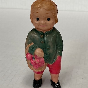 Vintage (1940s) Celluloid Boy Holding a Basket of Apples