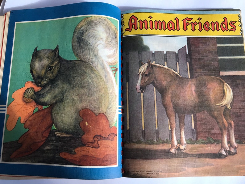 May include: A vintage children's book titled "Animal Friends" with a squirrel eating an acorn on the left page and a brown horse standing in a field on the right page.