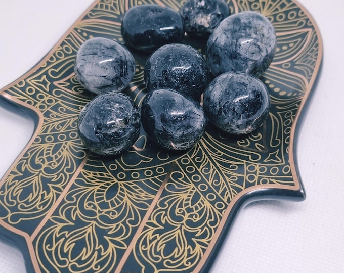 clear quartz with black tourmaline tumbled stone