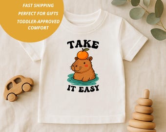 Lustiges Capybara Kleinkind Shirt: "Take It Easy" Tier T-Shirt."