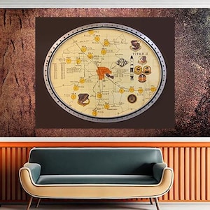 May include: A circular map with a silver frame, featuring a detailed layout with yellow markers and text. The map is mounted on a brown background, above a teal sofa with a tan trim. The wall has a textured, reddish-brown finish.