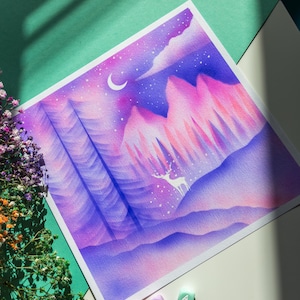 May include: A watercolor painting of a purple and pink mountain range with a white deer in the foreground. The sky is a dark blue with a crescent moon and stars. The painting is on a white background.