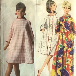 May include: Vintage Butterick sewing pattern featuring three dress designs. The pattern includes a pink plaid dress, a white polka dot dress with red trim, and a floral print dress. Sizes available are small, medium, and large.