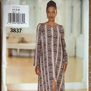 May include: A sewing pattern for a long dress with a geometric print in shades of brown and cream. The pattern includes the size range XS-S-M and the number 3837. The text "see & sew NOW YES! IT'S easy" is also visible.