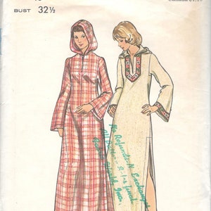 May include: Vintage sewing pattern for two long dresses. The pattern is for sizes 8 to 18 and includes instructions for a plaid dress with a hood and a solid dress with a slit up the side. The pattern is from Butterick and is number 3079.