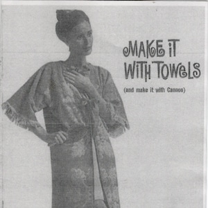 May include: An advertisement featuring a woman wearing a floral patterned robe with fringe trim. The text "MAKE IT WITH TOWELS" is displayed above the woman, with "Cannon homemaking service" below.