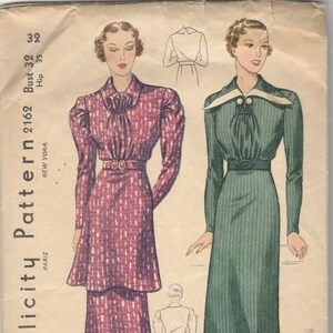 May include: Vintage Simplicity sewing pattern for a dress, size 32. The pattern shows two different styles of dresses, one in green and one in pink. The pattern is from the 1940s and includes instructions for making the dress.